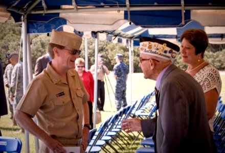 US Navy 091001-N-7874H-169 Rear Adm. Ned Deets speaks with Frank Chebatar, president of the Pearl Harbor Survivors Association, at the conclusion of the base consolidation ceremony