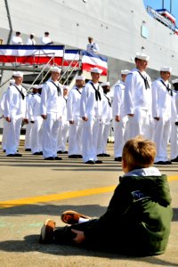 US Navy 090930-N-3595W-317 The grandson of Vice Adm. Frank Donovan watches as the decommissioning crew of the amphibious transport dock ship USS Nashville (LPD 13) departs the ship for the final time