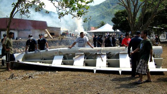 US Navy 091001-N-0000X-001 Sailors assigned to the guided-missile frigate USS Ingraham (FFG 61) clear away debris during disaster recovery efforts in Pago Pago