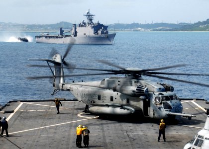 US Navy 090930-N-6692A-072 Sailors aboard the amphibious dock landing ship USS Tortuga (LSD 46) tend to a Marine Corps CH-53 Sea Stallion helicopter during flight operations