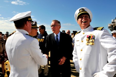 US Navy 090930-N-3595W-379 Cmdr. Brian Peterson, officer-in-charge of the amphibious transport dock ship USS Nashville (LPD 13), smiles as he takes a last look at the ship after the official party is dismissed