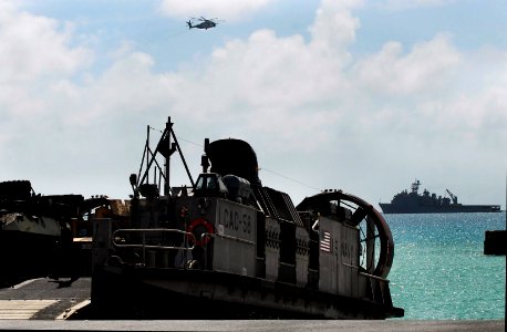 US Navy 090930-N-0807W-250 A Landing Craft, Air Cushion (LCAC) assigned to Assault Craft Unit (ACU) 5 stands by for equipment and personnel onload during LCAC operations with the amphibious dock landing ship USS Harpers Ferry (