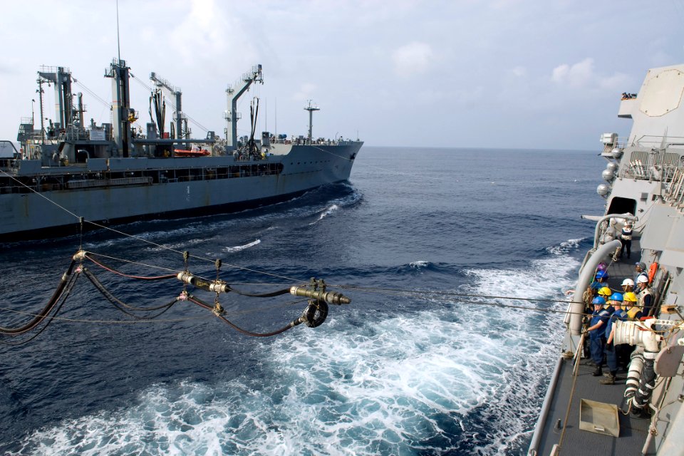 US Navy 091005-N-9123L-012 The Military Sealift Command fleet replenishment oiler USNS Walter S. Diehl (T-AO-193) sends a fuel line to Sailors aboard the guided-missile destroyer USS McCampbell (DDG 85)