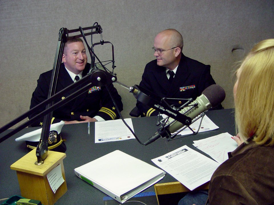 US Navy 091002-N-2888Q-002 Lt. Cmdr. Damon Slutz, commanding officer of Navy Operation Support Center Albuquerque, left, and Lt. Kris Hooper, assigned to the Navy Office of Community Outreach, conduct a radio interview with Amy