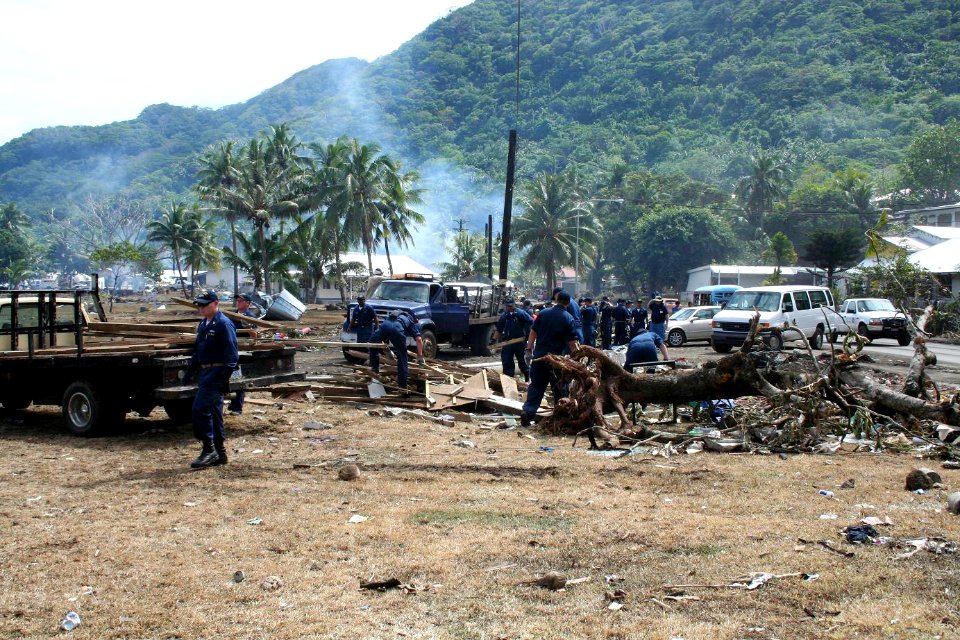 US Navy 091002-N-0000X-001 Sailors assigned to the guided-missile frigate USS Ingraham (FFG 61) clear away debris during disaster recovery efforts in Pago Pago,