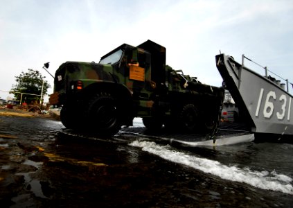 US Navy 091005-N-0807W-476 A U.S. Marine Corps 7-ton truck rolls off Landing Craft Utility 1631, assigned to the amphibious dock landing ship USS Harpers Ferry (LSD 49), during an equipment and supply offload