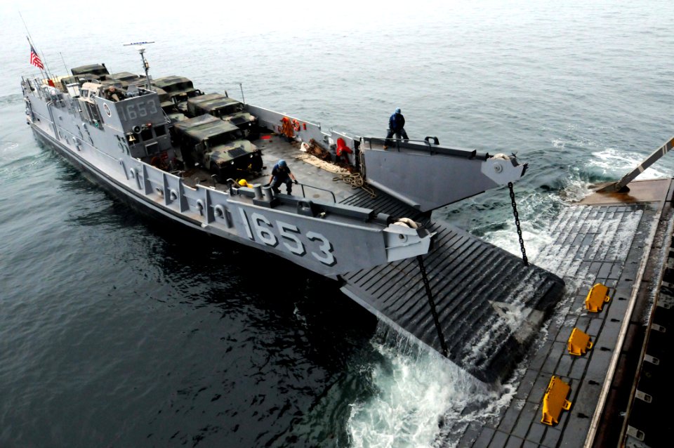 US Navy 091005-N-0890S-022 Landing Craft Unit (LCU) 1653 enters the well deck of the multi-purpose amphibious assault ship USS Wasp (LHD 1) off the coast of North Carolina