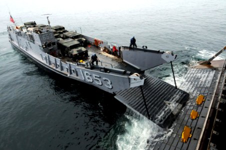 US Navy 091005-N-0890S-022 Landing Craft Unit (LCU) 1653 enters the well deck of the multi-purpose amphibious assault ship USS Wasp (LHD 1) off the coast of North Carolina