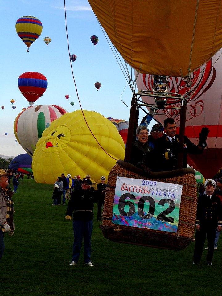 US Navy 091003-N-2888Q-007 Rear Adm. Paul Bushong, commander of Submarine Group 2, and his wife Dona, lift-off in a hot air balloon at the Albuquerque International Balloon Fiesta