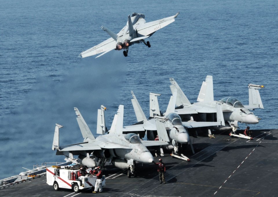 US Navy 091007-N-3038W-180 An F-A-18E Super Hornet assigned to the Tophatters of Strike Fighter Squadron (VFA) 14 launches from the flight deck of the aircraft carrier USS Nimitz (CVN 68)