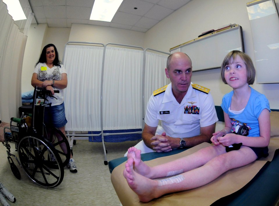 US Navy 091007-N-6220J-014 ear Adm. Bill Goodwin, Assistant Chief of Naval Operations for the Next Generation Enterprise Network, visits a young patient at Shriners Hospital for Children during a Caps For Kids event in Greenvil