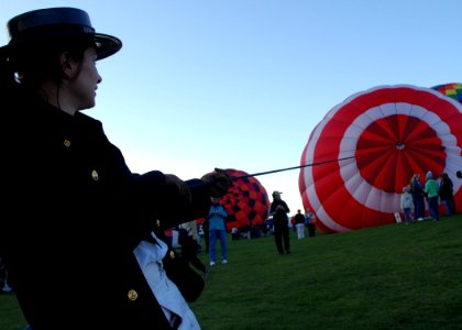 US Navy 091004-N-2893B-003 Aviation Electrician's Mate 3rd Class Tenika Fugate, assigned to USS Constitution, steadies an inflating hot air balloon at the Albuquerque International Balloon Fiesta during Albuquerque Navy Week