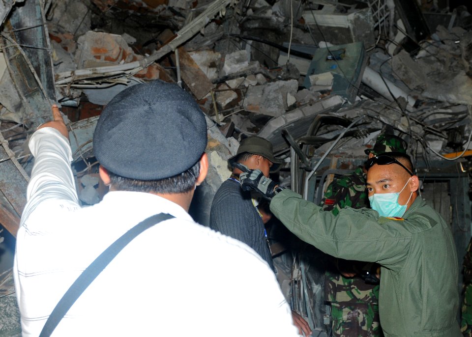 US Navy 091007-N-9950J-104 U.S. Air Force Lt. Tony Truong, a doctor assigned to the 353rd Special Operations Group, leads recovery efforts at a hotel in Padang