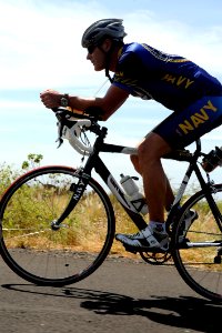 US Navy 091006-N-0555B-422 Lt. Cmdr. Don Cross trains on the Kuakini Highway for the 2009 Ford Ironman World Championship triathlon in Kailua-Kona,