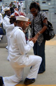 US Navy 091007-N-6764G-072 Culinary Specialist 3rd Class Corey Evans, assigned to the guided-missile frigate USS Carr (FFG 52), proposes to his girlfriend minutes after returning home from a six-month deployment
