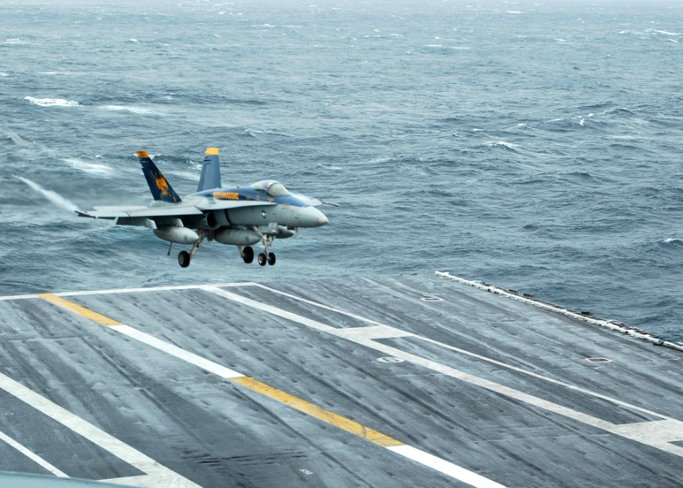 US Navy 091006-N-7191M-069 An F-A-18C Hornet from the Golden Dragons of Strike Fighter Squadron (VFA) 192 lands aboard the aircraft carrier USS George Washington (CVN 73)
