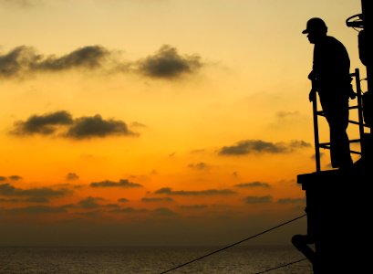 US Navy 091008-N-5345W-261 Lt. Dusty Gray looks out from the bridge deck as the amphibious dock landing ship USS Fort McHenry (LSD 43) conducts a replenishment at sea