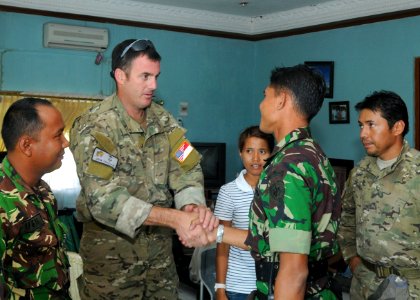US Navy 091007-N-9950J-084 U.S. Air Force Maj. John Traxler, ground force commander for the 353rd Special Operations Group, meets with Indonesian air force Capt. Mohammad Munir, a company commander in Battalion 461