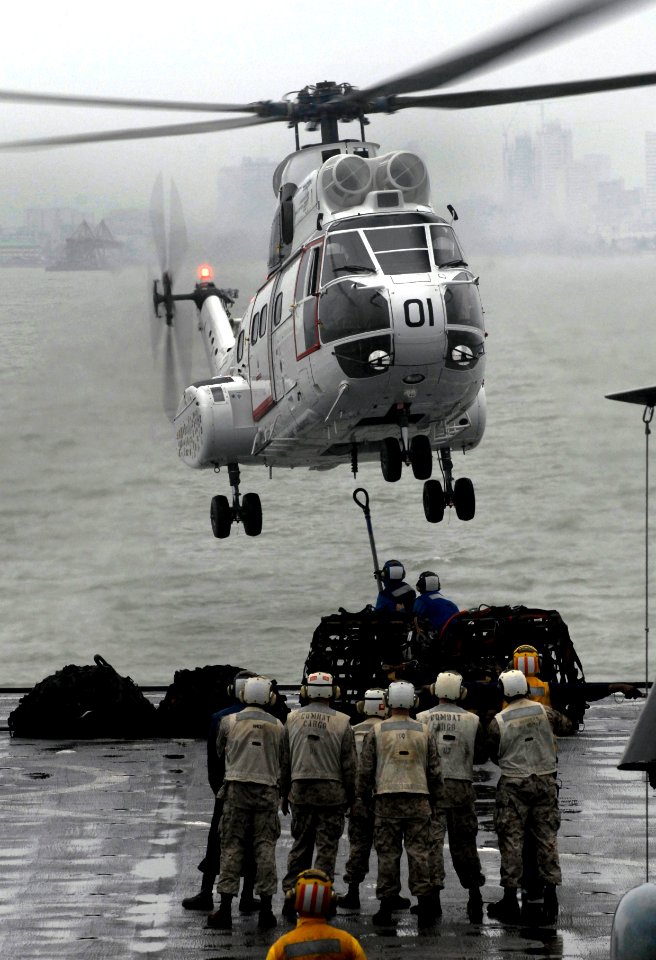 US Navy 091008-N-0807W-093 Sailors and Marines aboard the amphibious dock landing ship USS Harpers Ferry (LSD 49) conduct a vertical replenishment