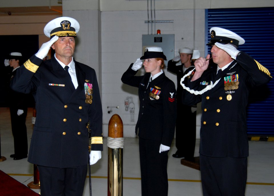 US Navy 091008-N-9860Y-001 Rear Adm. William Moran, commander of Patrol and Reconnaissance Group, is piped through side boys during a change of command ceremony