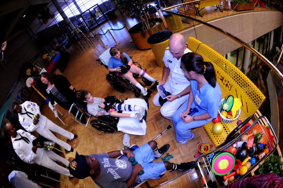 US Navy 091007-N-6220J-011 Rear Adm. Bill Goodwin, Assistant Chief of Naval Operations for the Next Generation Enterprise Network, visits with young patients at Shriners Hospital for Children in Greenville during a Caps For Kid