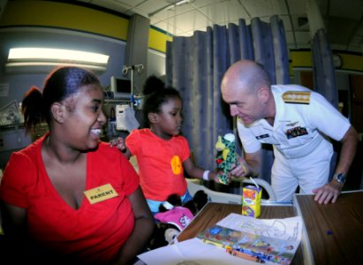 US Navy 091007-N-6220J-016 Rear Adm. Bill Goodwin, Assistant Chief of Naval Operations for the Next Generation Enterprise Network, shares a moment with a young patient at the Shriners Hospital for Children in Greenville during
