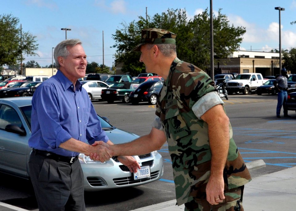 US Navy 091008-N-6889J-001 The Secretary of the Navy (SECNAV) the Honorable Ray Mabus is greeted by Capt. Ed Brown, commanding officer of Naval Construction Battalion Center (NCBC), Commander 20th Seabee Readiness Group (SRG),