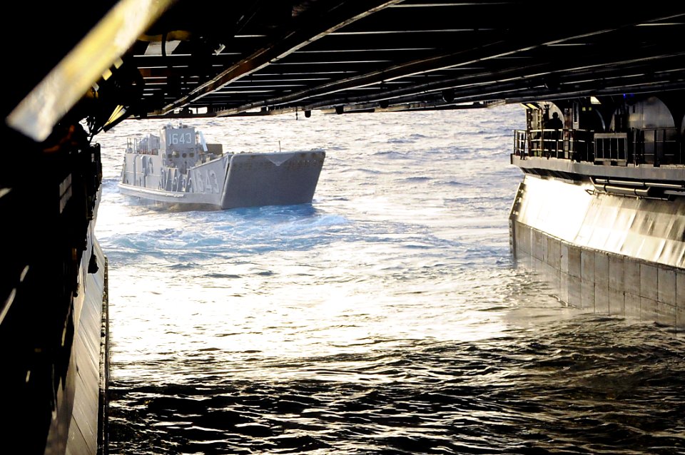 US Navy 091010-N-0890S-015 Landing Craft Utility (LCU) 1643 exits the well deck of the multi-purpose amphibious assault ship USS Wasp (LHD 1) to transfer Marines from the ship to Guantanamo Bay, Cuba
