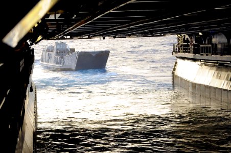 US Navy 091010-N-0890S-015 Landing Craft Utility (LCU) 1643 exits the well deck of the multi-purpose amphibious assault ship USS Wasp (LHD 1) to transfer Marines from the ship to Guantanamo Bay, Cuba