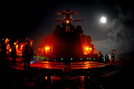US Navy 091010-N-1688B-049 Sailors conduct a night replenishment at sea aboard the guided-missile destroyer USS Cole (DDG 67)