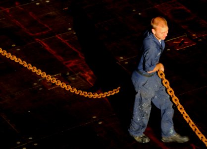 US Navy 091010-N-5345W-101 Boatswain's Mate Seaman Sean Church prepares for a stern gate marriage evolution with a landing craft unit aboard the amphibious dock landing ship USS Fort McHenry (LSD 43)