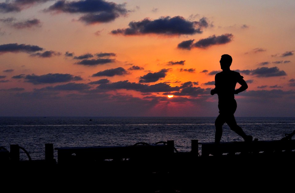 US Navy 091007-N-9740S-006 A Marine with the 22nd Marine Expeditionary Unit (22nd MEU) maintains physical readiness by exercising on the flight deck of the multi-purpose amphibious assault ship USS Bataan (LHD 5) photo