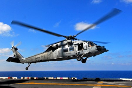 US Navy 091010-N-1512O-122 An MH-60S Sea Hawk helicopter from Helicopter Sea Combat Squadron (HSC) 22 takes off from the multi-purpose amphibious assault ship USS Bataan (LHD 5) during flight operations supporting Bright Star 2 photo