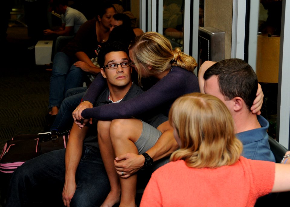 US Navy 091008-N-9095H-014 Lt. j.g. Daniel Davis, assigned to Explosive Ordnance Disposal Mobile Unit (EODMU) 12, embraces his wife at the Naval Station Norfolk Air Mobility Command Terminal before deploying to Iraq supporting
