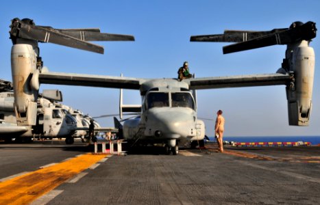 US Navy 091008-N-9740S-009 Marines assigned to Marine Medium Tiltrotor Squadron (VMM) 263 (Reinforced) conduct daily maintenance on an MV-22B Osprey aboard the multi-purpose amphibious assault ship USS Bataan (LHD 5)