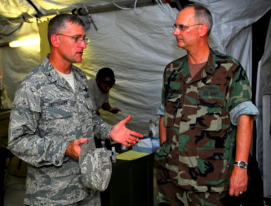 US Navy 091010-N-9123L-002 Air Force Col. Daniel Settergreen, Combined Readiness Group Commander, left, talks with Commander, Amphibious Force Seventh Fleet, Rear Adm. Richard Landolt