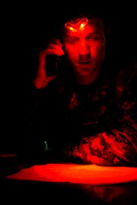 US Navy 091011-N-9950J-029 Marine 1st Lt. Geoffrey Gutierrez, air support control official for Marine Medium Helicopter Squadron (HMM) 265, uses a satellite communications link to contact the amphibious transport dock ship USS