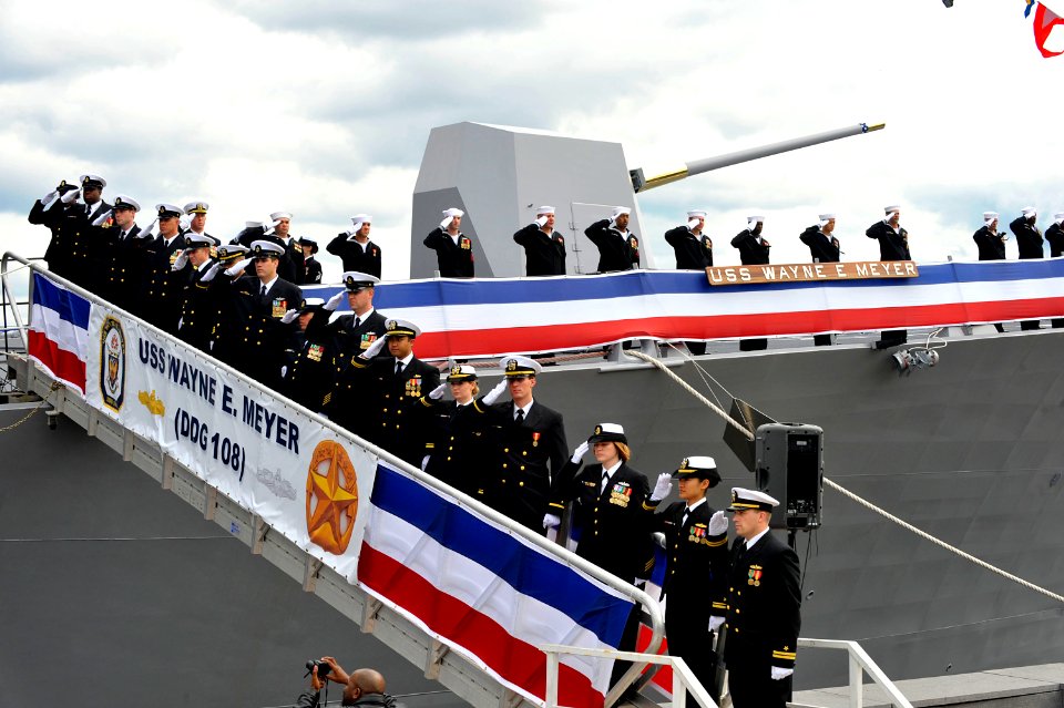US Navy 091010-N-8273J-156 Crew members render honors during the commissioning ceremony of the Arleigh Burke class guided-missile destroyer USS Wayne E. Meyer (DDG 108) at Penn's Landing in Philadelphia
