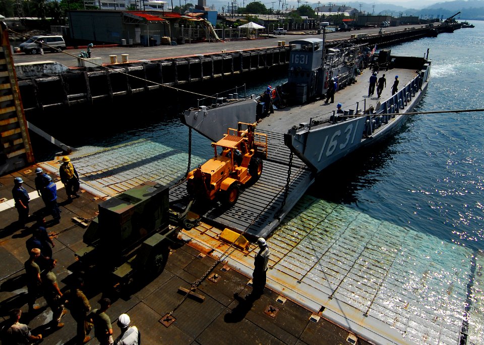 US Navy 091012-N-0807W-276 Landing Craft Utility 1631 performs a stern gate marriage with the amphibious dock landing ship USS Harpers Ferry (LSD 49) during a U.S. Marine Corps equipment offload