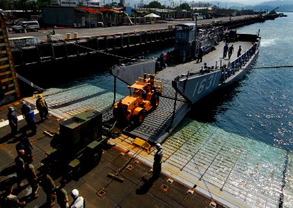 US Navy 091012-N-0807W-276 Landing Craft Utility 1631 performs a stern gate marriage with the amphibious dock landing ship USS Harpers Ferry (LSD 49) during a U.S. Marine Corps equipment offload