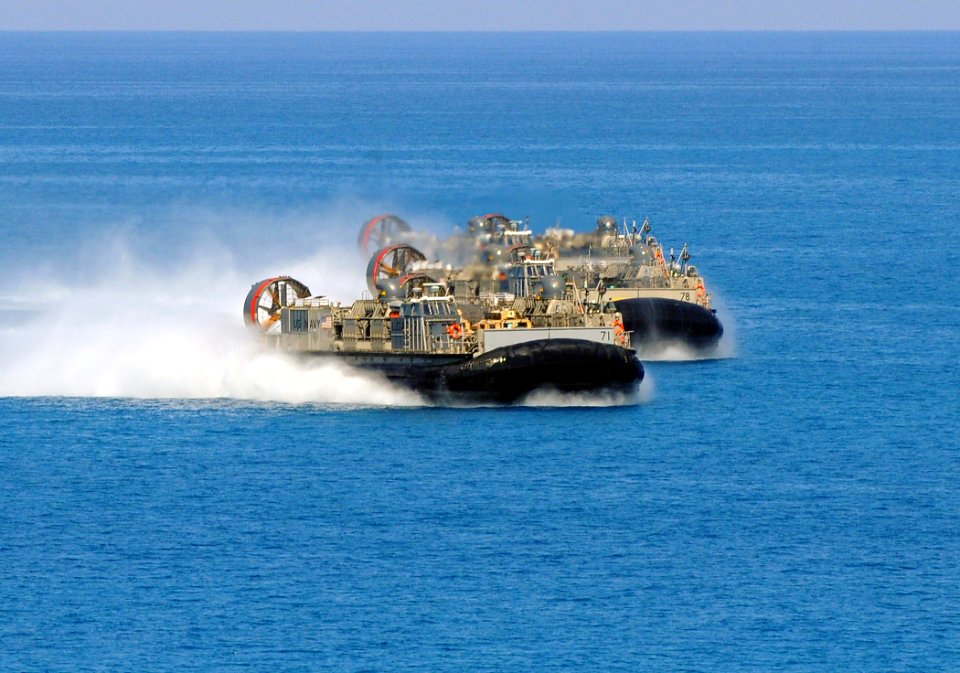 US Navy 091012-N-1831S-133 Three landing craft, air cushions (LCAC) are launched from the amphibious assault ship USS Bataan (LHD 5) during the biennial, multinational exercise Bright Star 2009