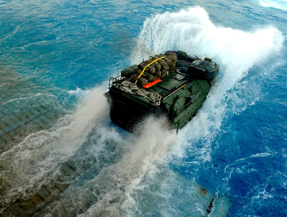 US Navy 091010-N-5345W-019 An amphibious assault vehicle (AAV) assigned to the 22nd Marine Expeditionary Unit (22nd MEU) exits the well deck of the amphibious dock landing ship USS Fort McHenry (LSD 43)