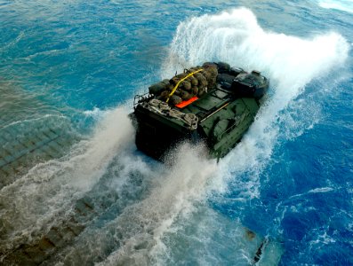 US Navy 091010-N-5345W-019 An amphibious assault vehicle (AAV) assigned to the 22nd Marine Expeditionary Unit (22nd MEU) exits the well deck of the amphibious dock landing ship USS Fort McHenry (LSD 43)