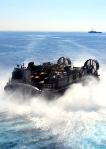 US Navy 091012-N-3165S-056 A landing craft, air cushion (LCAC) from Assault Craft Unit (ACU) 4 turns toward shore after exiting the well deck of the multi-purpose amphibious assault ship USS Bataan (LHD 5) during Exercise Brigh