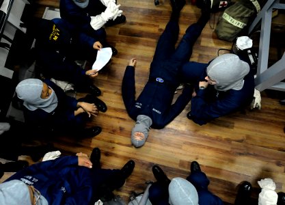 US Navy 091010-N-7280V-167 Medical training team members demonstrate the treatment of electric shock during a general quarters drill