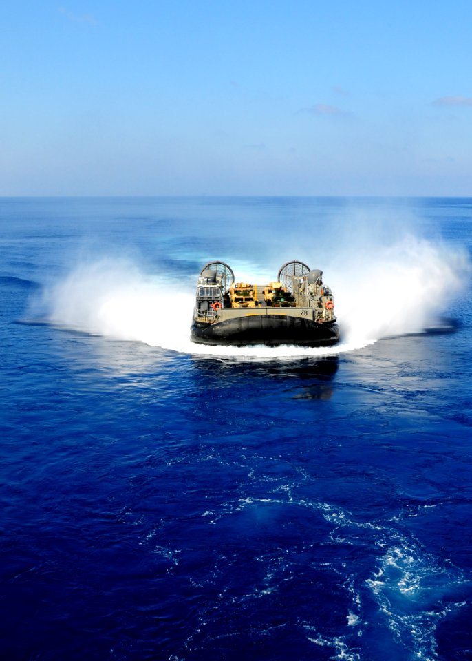 US Navy 091012-N-3165S-033 A landing craft, air cushion from Assault Craft Unit (ACU) 4 prepares to enter the well deck of the multi-purpose amphibious assault ship USS Bataan (LHD 5)