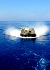 US Navy 091012-N-3165S-033 A landing craft, air cushion from Assault Craft Unit (ACU) 4 prepares to enter the well deck of the multi-purpose amphibious assault ship USS Bataan (LHD 5) photo