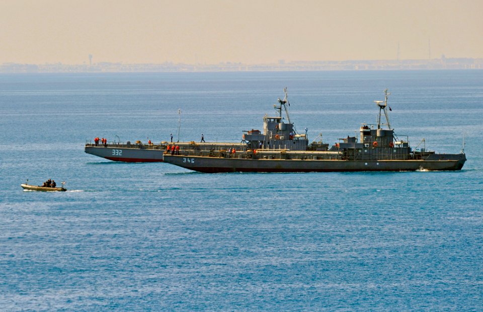 US Navy 091012-N-5345W-152 A rigid-hull inflatable boat from the amphibious dock landing ship USS Fort McHenry (LSD 43) and two Egyptian navy amphibious landing craft make their way to shore