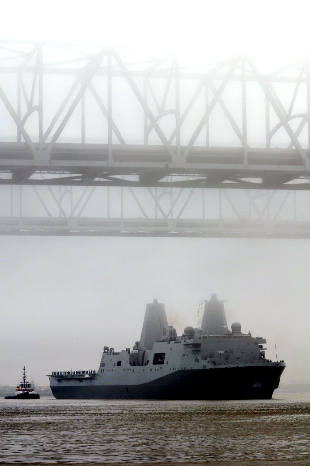 US Navy 091013-N-9712C-005 The amphibious transport dock ship Pre-Commissioning Unit (PCU) New York (LPD 21) maneuvers under the New Orleans Crescent City Connection bridge on the Mississippi River after departing Northrop Grum