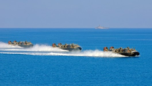 US Navy 091012-N-1831S-153 Three landing craft, air cushion vehicles approach the shore after launching from the multi-purpose amphibious assault ship USS Bataan (LHD 5) during Bright Star 2009 photo